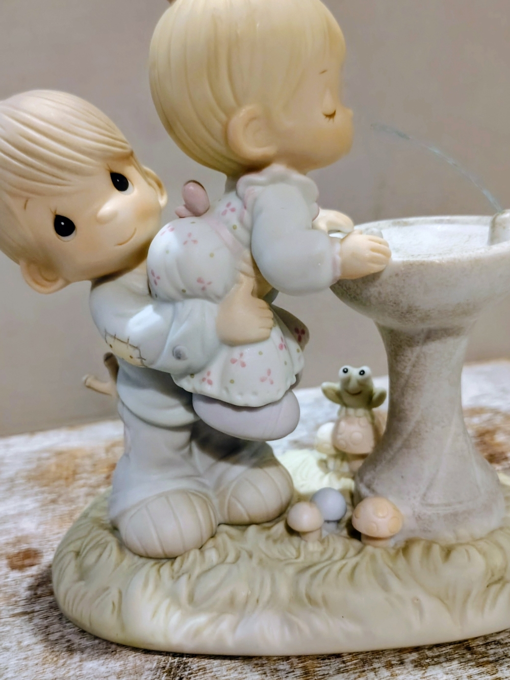 Precious Moments Love Uplifting Boy Holding Girl Up To Fountain